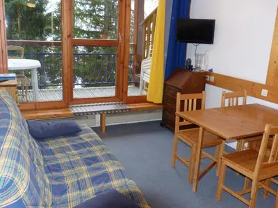 Coin salon dans l'établissement Duplex 2 pièces, 6 pers., ski aux pieds, Arc 1800, animaux admis - FR-1-411-219