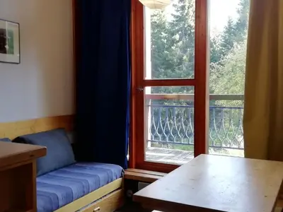 Coin salon dans l'établissement Duplex skis aux pieds pour 5 pers. à Charmettoger avec WIFI - FR-1-411-287