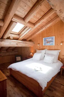 Un ou plusieurs lits dans un hébergement de l'établissement Chalet L’Etagne