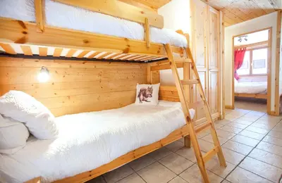 Un ou plusieurs lits dans un hébergement de l'établissement Chalet L’Etagne