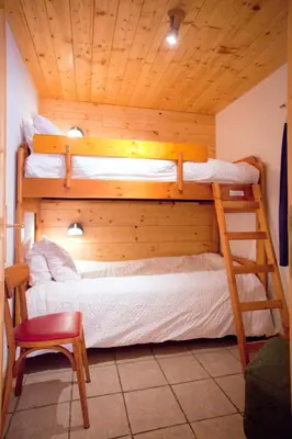 Un ou plusieurs lits dans un hébergement de l'établissement Chalet L’Etagne