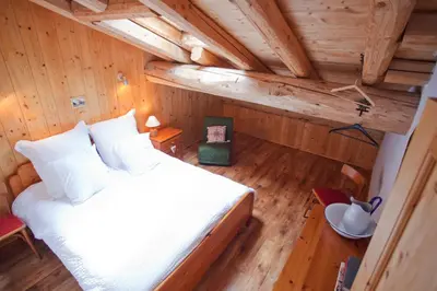 Un ou plusieurs lits dans un hébergement de l'établissement Chalet L’Etagne