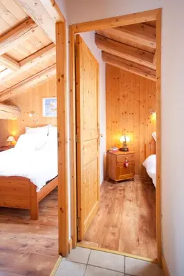 Un ou plusieurs lits dans un hébergement de l'établissement Chalet L’Etagne