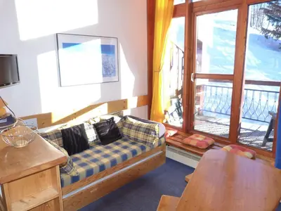Coin salon dans l'établissement Duplex cosy ski-in/ski-out aux Arcs 1800 avec WIFI et animaux acceptés - FR-1-411-310