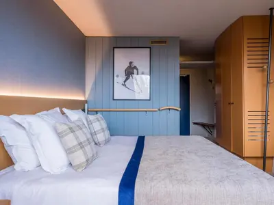 Un ou plusieurs lits dans un hébergement de l'établissement Belambra Clubs Arc 1800 - Hôtel Du Golf