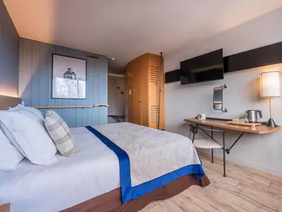 Un ou plusieurs lits dans un hébergement de l'établissement Belambra Clubs Arc 1800 - Hôtel Du Golf