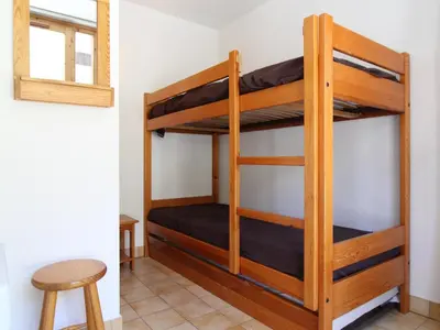Un ou plusieurs lits superposés dans un hébergement de l'établissement PPB011 Appartement 4 pers - Résidence au pied des pistes - FR-1-508-141