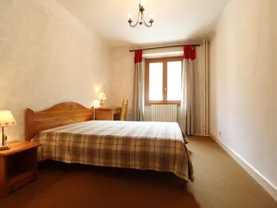 Un ou plusieurs lits dans un hébergement de l'établissement Appartement spacieux 5 pers avec balcon et wifi à Lanslebourg - FR-1-508-146