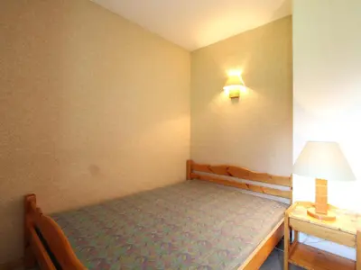 Un ou plusieurs lits dans un hébergement de l'établissement Appartement cosy 4 pers, pied des pistes, balcon, parking, WiFi - FR-1-508-192