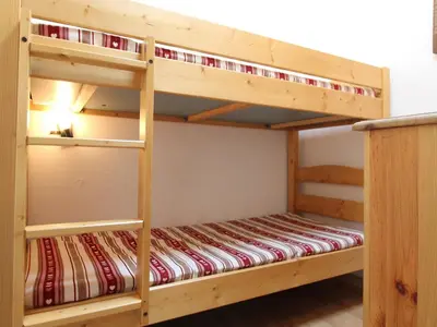 Un ou plusieurs lits dans un hébergement de l'établissement Appartement Duplex pour 10 Personnes au Coeur de Val Cenis Lanslebourg - FR-1-508-48