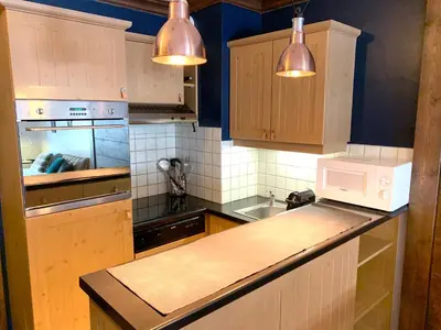 Cuisine ou kitchenette dans l'établissement Arc 1950 Manoir Savoie Skis aux pieds
