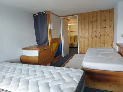 Un ou plusieurs lits dans un hébergement de l'établissement Duplex confortable pour 6 personnes à Arc 1800 - FR-1-411-191