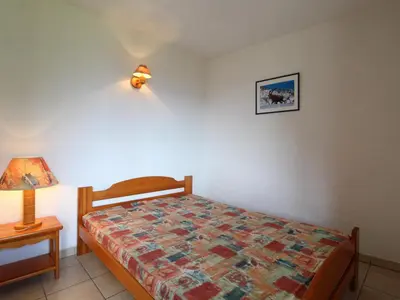 Un ou plusieurs lits dans un hébergement de l'établissement Appartement 6 pers au pied des pistes avec Wifi gratuit - FR-1-508-1