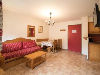 Télévision ou salle de divertissement dans l'établissement Appartement spacieux 6 pers au pied des pistes avec wifi et parking - FR-1-508-13