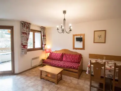Coin salon dans l'établissement Appartement spacieux 6 pers au pied des pistes avec wifi et parking - FR-1-508-13