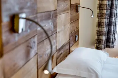 Un ou plusieurs lits dans un hébergement de l'établissement Chalet Hotel Du Fornet