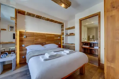 Un ou plusieurs lits dans un hébergement de l'établissement Chalet Hotel Du Fornet