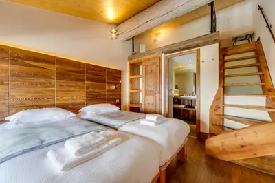 Un ou plusieurs lits dans un hébergement de l'établissement Chalet Hotel Du Fornet