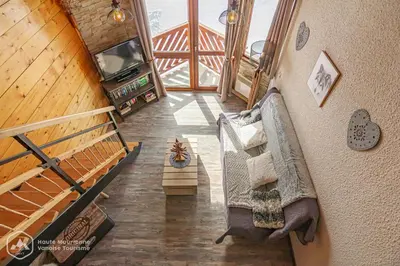 Télévision ou salle de divertissement dans l'établissement Résidence Les hauts de Val Cenis
