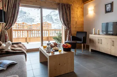 Coin salon dans l'établissement CGH Résidence Boutique Le Lodge des Neiges