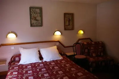 Un ou plusieurs lits dans un hébergement de l'établissement Hôtel du Glacier des Evettes