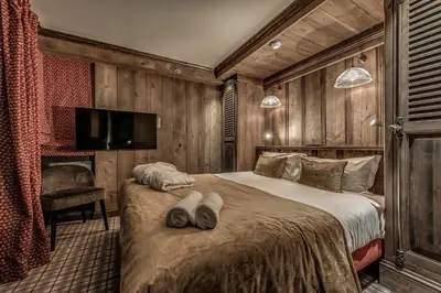 Un ou plusieurs lits dans un hébergement de l'établissement Hotel & Spa Le Val d'Isère
