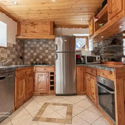 Cuisine ou kitchenette dans l'établissement La Centaurée