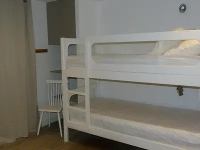 Un ou plusieurs lits dans un hébergement de l'établissement Appartement rénové 4 pièces pour 8 au coeur d'Arc 1800, animaux admis - FR-1-411-600
