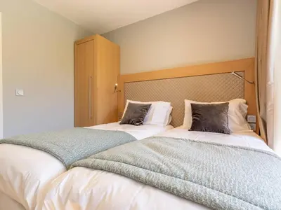 Un ou plusieurs lits dans un hébergement de l'établissement Duplex 4 chambres avec piscine, spa et parking aux Arcs 1800 - FR-1-352-55