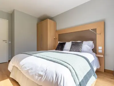 Un ou plusieurs lits dans un hébergement de l'établissement Duplex 4 chambres avec piscine, spa et parking aux Arcs 1800 - FR-1-352-55