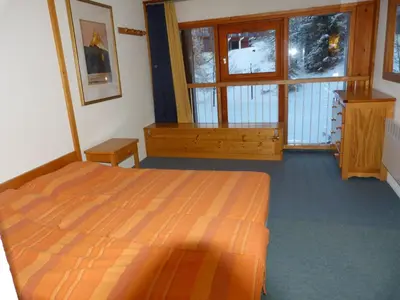 Un ou plusieurs lits dans un hébergement de l'établissement Duplex skis aux pieds 3 pièces, 8 pers, Animaux admis - FR-1-411-59