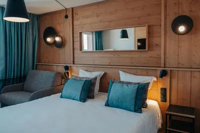 Un ou plusieurs lits dans un hébergement de l'établissement Hôtel L'Eden des Cimes - Vacances Bleues - Belle Plagne 2100