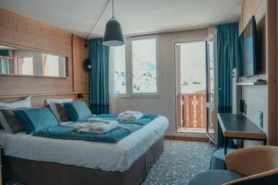 Un ou plusieurs lits dans un hébergement de l'établissement Hôtel L'Eden des Cimes - Vacances Bleues - Belle Plagne 2100