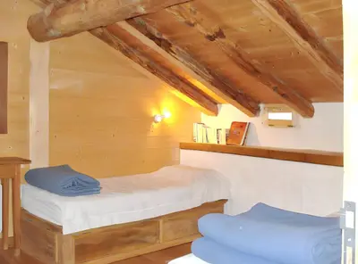Un ou plusieurs lits dans un hébergement de l'établissement Chalet confortable à Sainte-Foy-Tarentaise avec vue sur la montagne