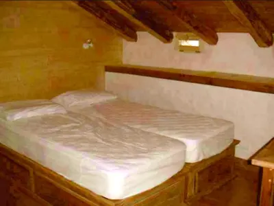 Un ou plusieurs lits dans un hébergement de l'établissement Chalet confortable à Sainte-Foy-Tarentaise avec vue sur la montagne