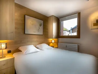 Un ou plusieurs lits dans un hébergement de l'établissement Charmant appartement 2 chambres, centre Val-d'Isère, proche pistes, WIFI inclus - FR-1-519-2