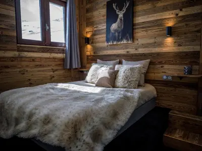 Un ou plusieurs lits dans un hébergement de l'établissement Magnifique Duplex Oneigedor Départ ski aux pieds et vue montagne
