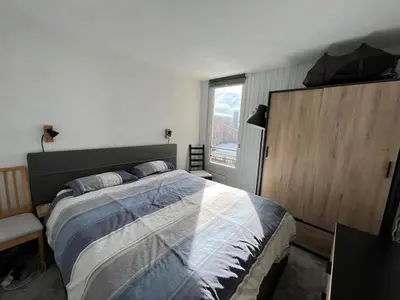 Un ou plusieurs lits dans un hébergement de l'établissement Residence Bollin No.21