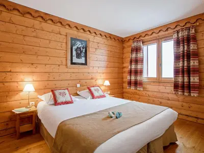 Un ou plusieurs lits dans un hébergement de l'établissement Residence l'Ecrin des Neiges - maeva Home