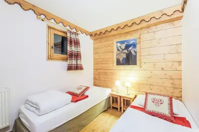 Un ou plusieurs lits dans un hébergement de l'établissement Residence l'Ecrin des Neiges - maeva Home