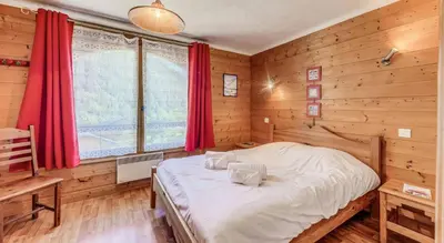 Un ou plusieurs lits dans un hébergement de l'établissement Résidence Les Soldanelles - Chalets pour 10 Personnes MAE-2760