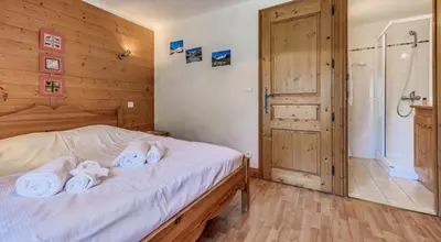 Un ou plusieurs lits dans un hébergement de l'établissement Résidence Les Soldanelles - Chalets pour 10 Personnes MAE-2760