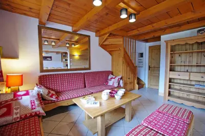 Coin salon dans l'établissement Résidence L'echayer - Chalets pour 12 Personnes MAE-3285