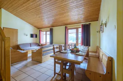 Coin salon dans l'établissement Résidence Les Balcons De Val Cenis Le Haut