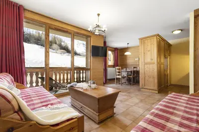 Coin salon dans l'établissement Résidence Les Balcons de Val Cenis Village
