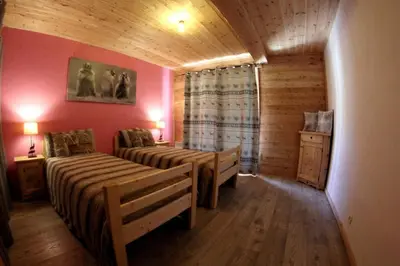 Un ou plusieurs lits dans un hébergement de l'établissement Chalet La Fontanette