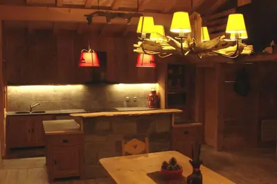 Cuisine ou kitchenette dans l'établissement Chalet La Fontanette