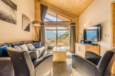 Coin salon dans l'établissement Résidence Les Balcons EtoilÉs - Appartement 4 au pied des pistes MAE-3256