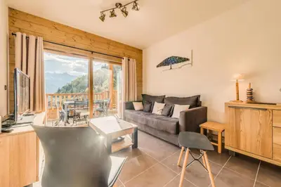 Coin salon dans l'établissement Résidence Les Balcons EtoilÉs - Appartement 4 au pied des pistes MAE-3263