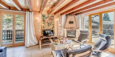 Coin salon dans l'établissement Résidence Hameau Des Rochers - Chalets pour 14 Personnes MAE-3284